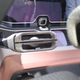 Very concepty steering wheel, with the Nomi AI square on the dashboard behind it. Photos and reporting from Stef Schrader for Jalopnik